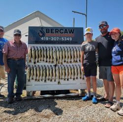 Successful walleye fishing trip in Port Clinton OH with large catch displayed on cleaning station
