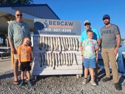Successful walleye fishing trip in Port Clinton OH with multiple fish displayed on cleaning board