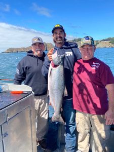 Three anglers with a 29-inch fish in Richmond
