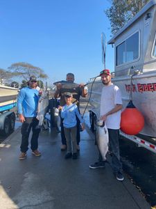 Two people fishing in California with big 29-inch fish