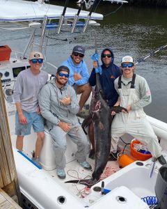 A group of 5 people fishing for a blue marlin in Fort Lauderdale