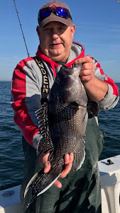 A lone angler fishing on the shores of Long Island