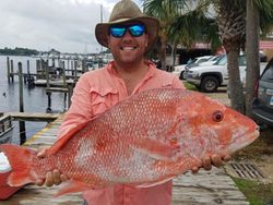 A lone angler casting a line in Carrabelle