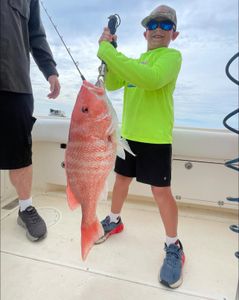 Red snapper caught while fishing in Carrabelle FL displayed on boat deck