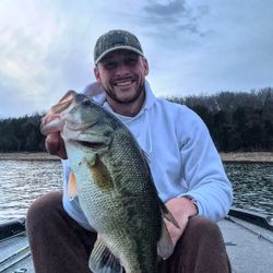 Angler holding a largemouth bass in Nashville