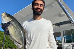 A lone fisherman reeling in a catch in Puerto Rico