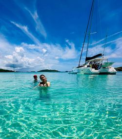 Two people fishing on the beach in PR