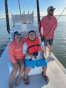 Three people fishing in TX