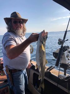 A single angler fishing in the beautiful waters of Isle La Motte