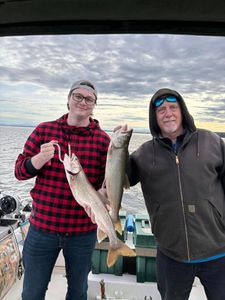 Two anglers fishing for beautiful lake trout on Isle La Motte