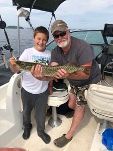 Angler with a large Northern Pike caught while fishing on Isle La Motte