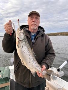 Angler fishing in scenic Vermont landscape
