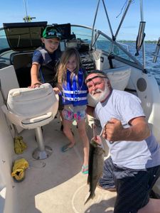 3 anglers with a big fish in Vermont