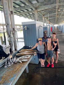 Four people fishing in Galveston