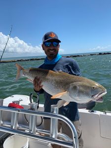 A person fishing in Galveston