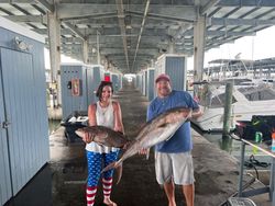 Two anglers fishing in Texas with big 36-inch fish