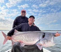 Two people fishing on the sand in Sand Springs