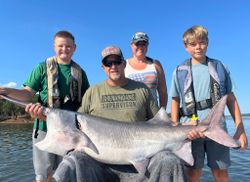 Four friends enjoying a fishing trip at Sand Springs