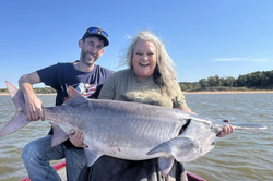 Two people enjoying a fishing trip at Sand Springs
