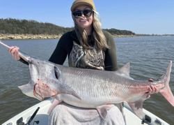 1 fisherman holding a 35-inch fish in OK location
