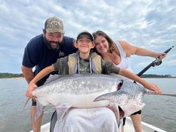 3 people fishing on the water in OK