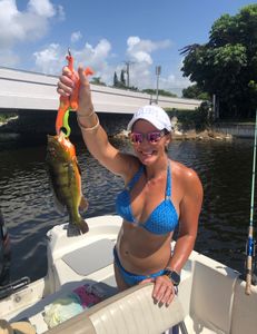 Proud angler with a 14-inch Peacock Bass in Delray Beach