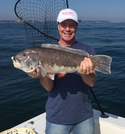 A person fishing with a rod in New Jersey