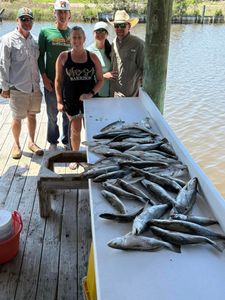 5 people enjoying fishing in Bay St. Louis