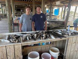Two people enjoying fishing in Bay St. Louis