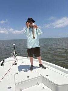 A person fishing in the scenic Bay St. Louis
