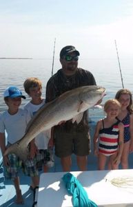 A group of 5 people fishing in Florida