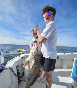 Two people fishing at Fernandina Beach