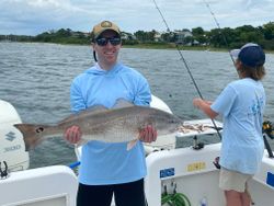 Angler catches a redfish in FL