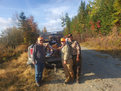 Three people having a great time fishing and hunting in Harmony