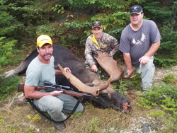 Three people enjoying a fishing and hunting trip in Harmony