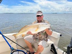 Angler with a 25-inch fish in Darien