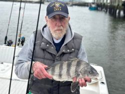 Angler with a catch of a Black Drum fish in Darien