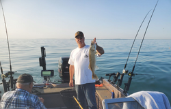 Lone angler reeling in a big 21-inch fish at Lakeside Marblehead