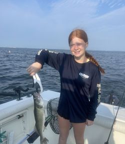 A person fishing at the lakeside in Marblehead