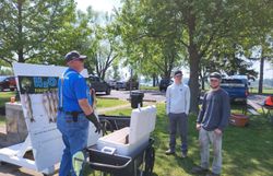 Three people fishing at the lakeside in Marblehead
