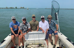 5 people fishing at the lakeside in Marblehead
