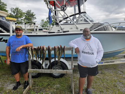 Two anglers fishing in OH with two fish