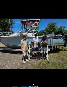 Three people fishing and hunting in Lorain