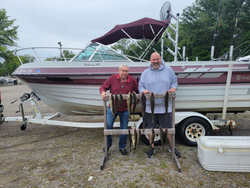 Two people fishing and hunting in Lorain