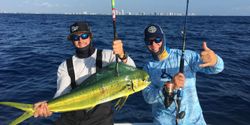 Angler holding a massive Mahi Mahi fish caught in Florida