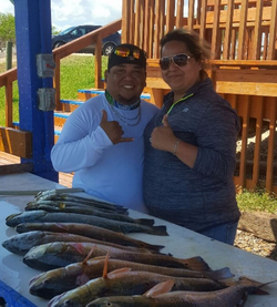 Two people fishing in TX