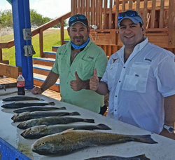 Two anglers fishing in Port Mansfield