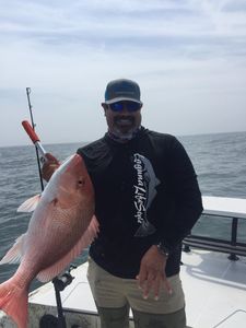 A lone angler fishing in Port Mansfield