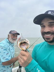 Casting lines under partly cloudy skies for the best deep sea action!