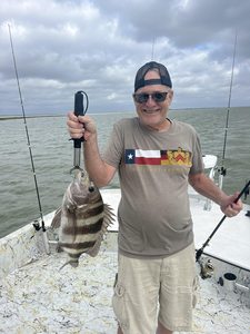 Reeling in a sheepshead on a partly cloudy day in Port Mansfield!